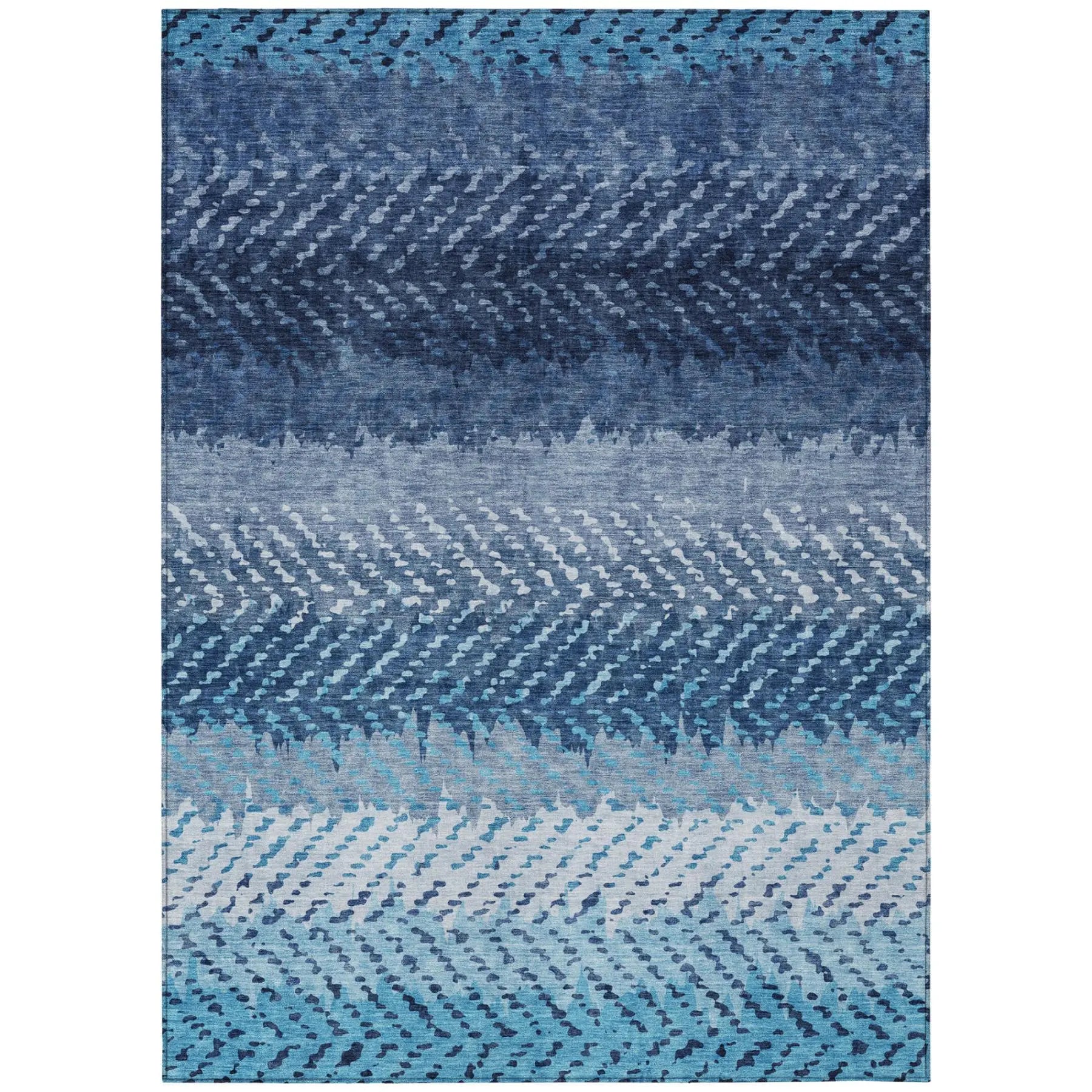 Abstract blue area rug featuring gradient hues in navy, teal, and light blue, made of durable synthetic fibers.