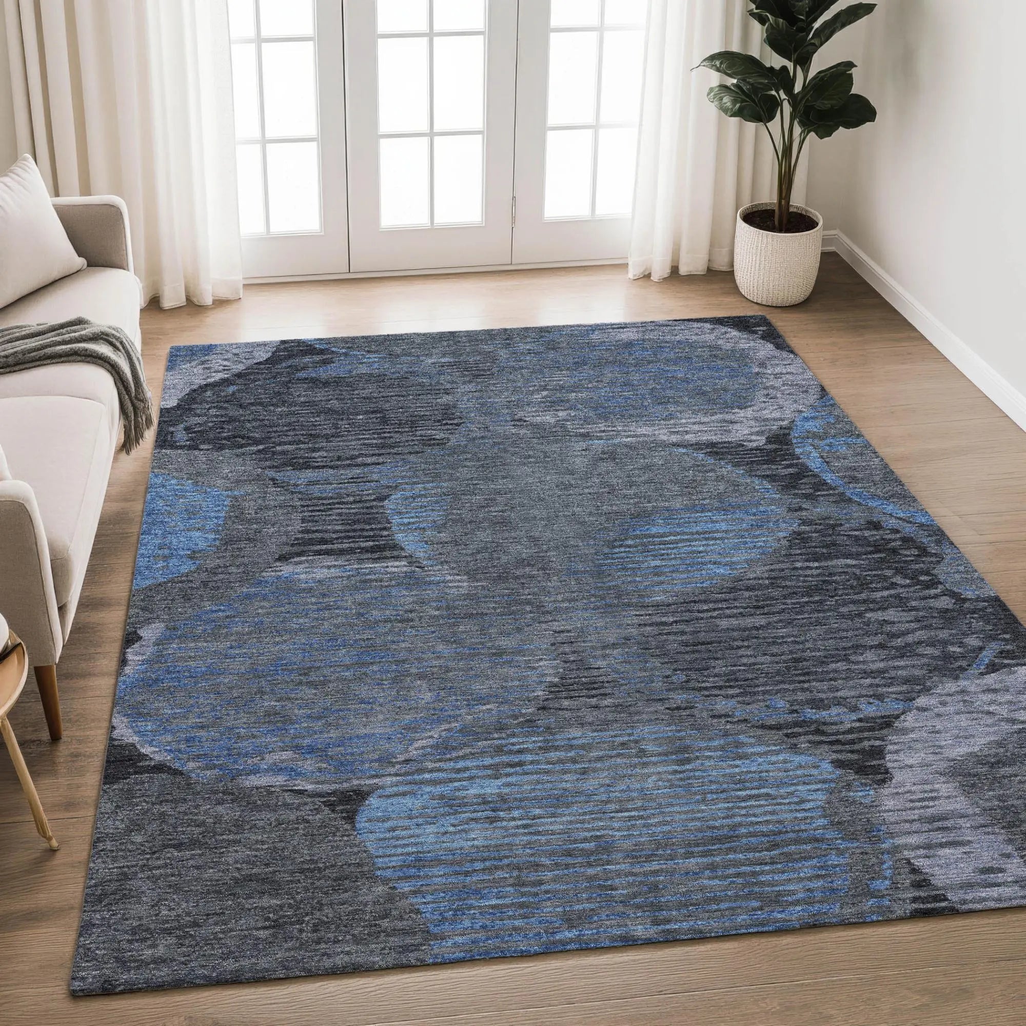 Blue and gray abstract round patterned area rug, soft texture, modern style, perfect for contemporary living rooms.