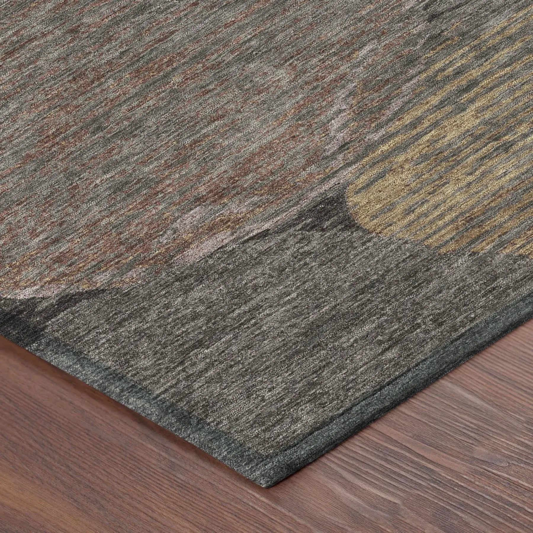 Multicolor abstract area rug with gray, gold, and rust tones, made of soft synthetic fibers for modern interiors.