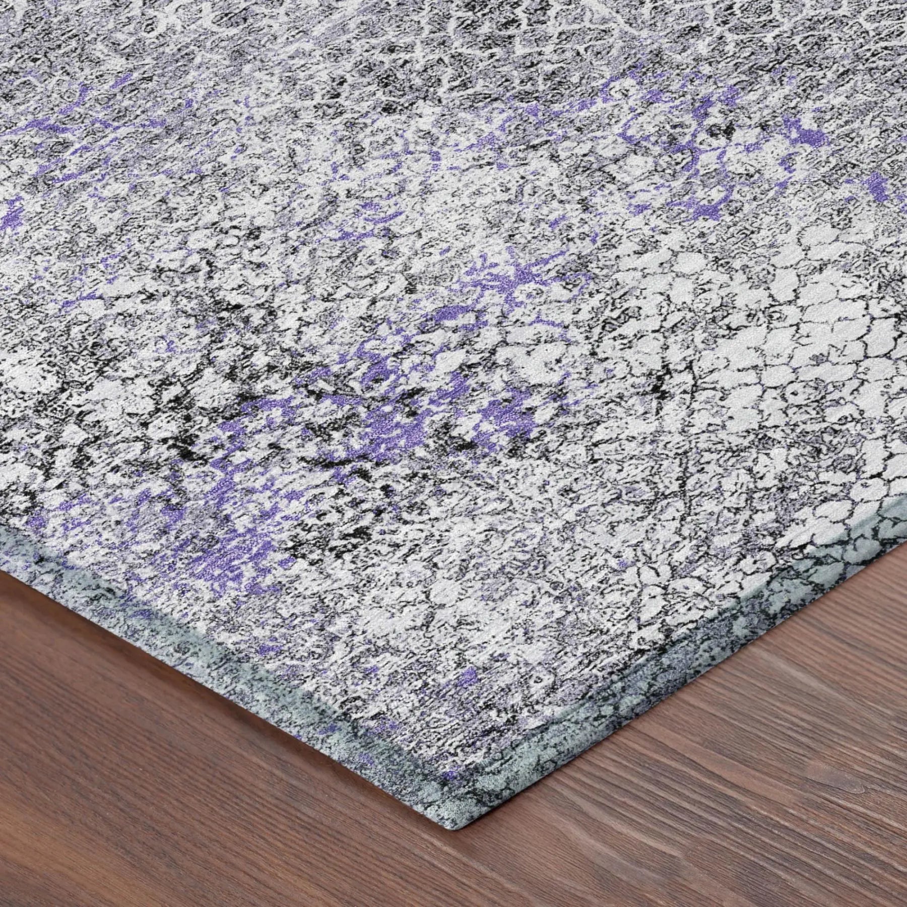 Textured gray and purple abstract area rug, modern design, perfect for contemporary home decor.