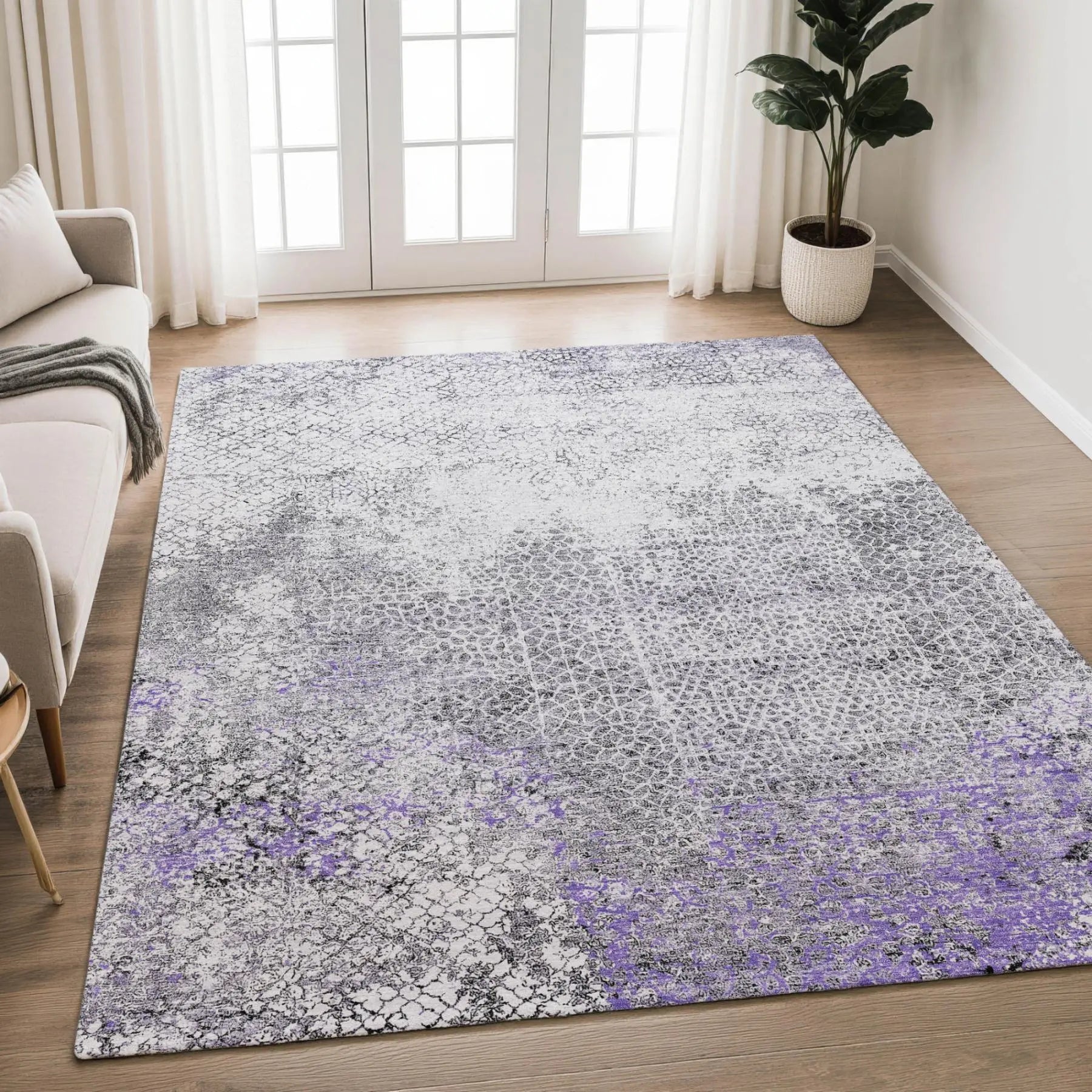 Lavender and gray modern area rug, abstract design, plush material, ideal for contemporary living spaces.