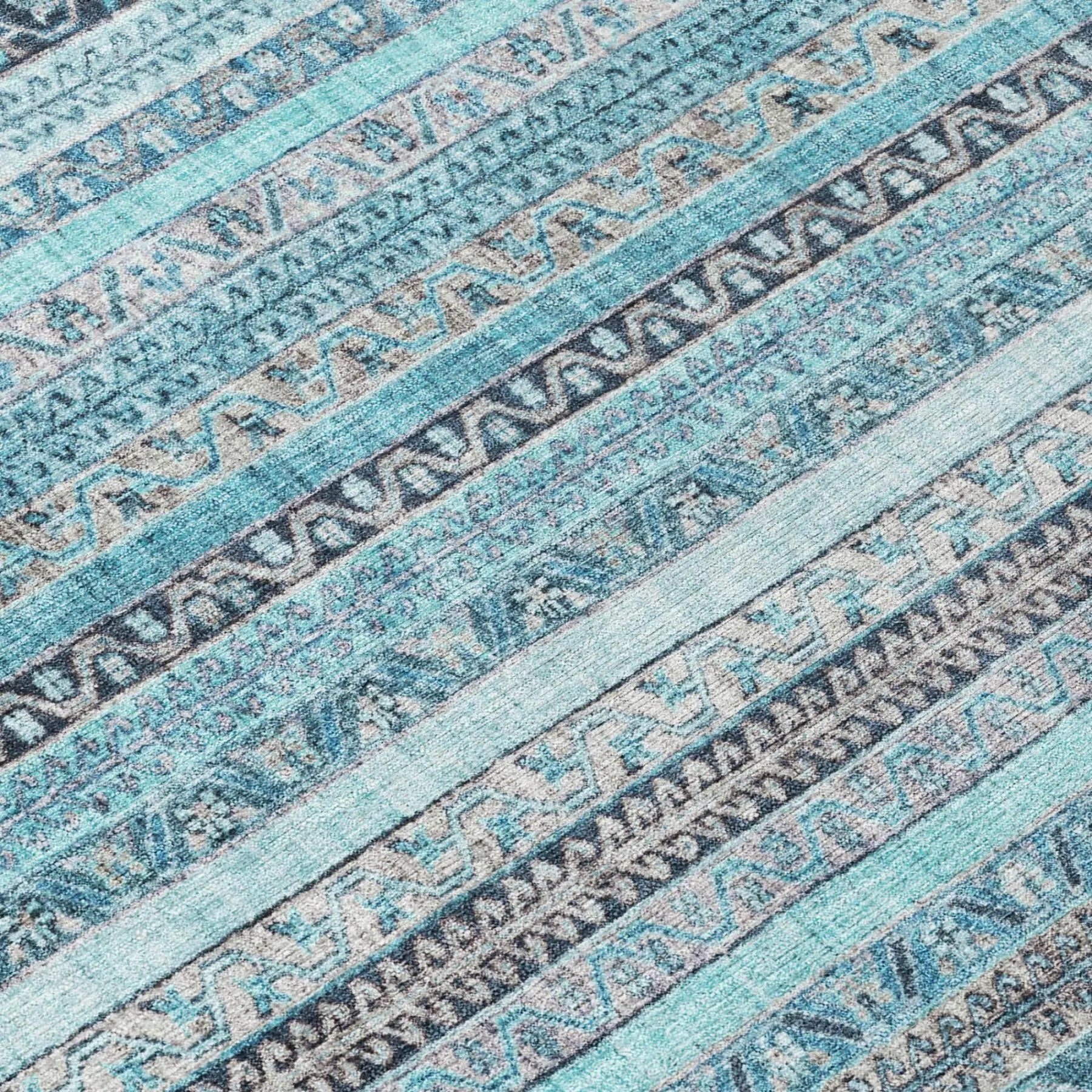 Blue and gray patterned area rug with geometric designs, crafted from soft, durable fibers for modern decor.