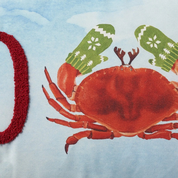 Red crab holiday-themed pillow cover with green mittens and snowy background, perfect for festive decor.