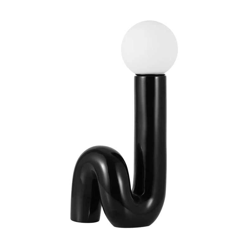 Black ceramic table lamp with a curved design, featuring a white glass bulb for a modern, artistic touch.
