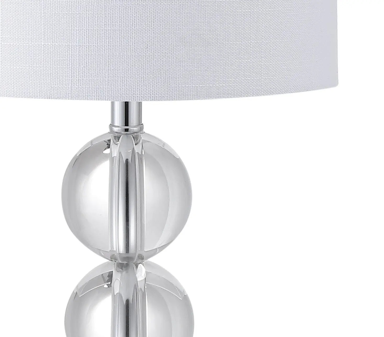 Clear crystal table lamp with white linen shade, modern design, perfect for contemporary home decor.