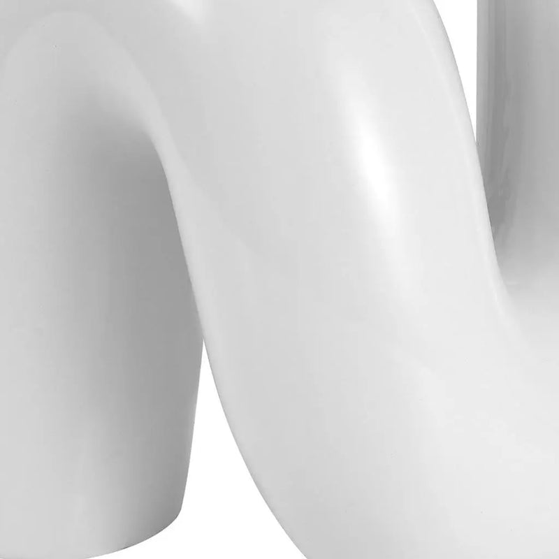 Glossy white ceramic vase with a unique wavy design, perfect for modern home decor.