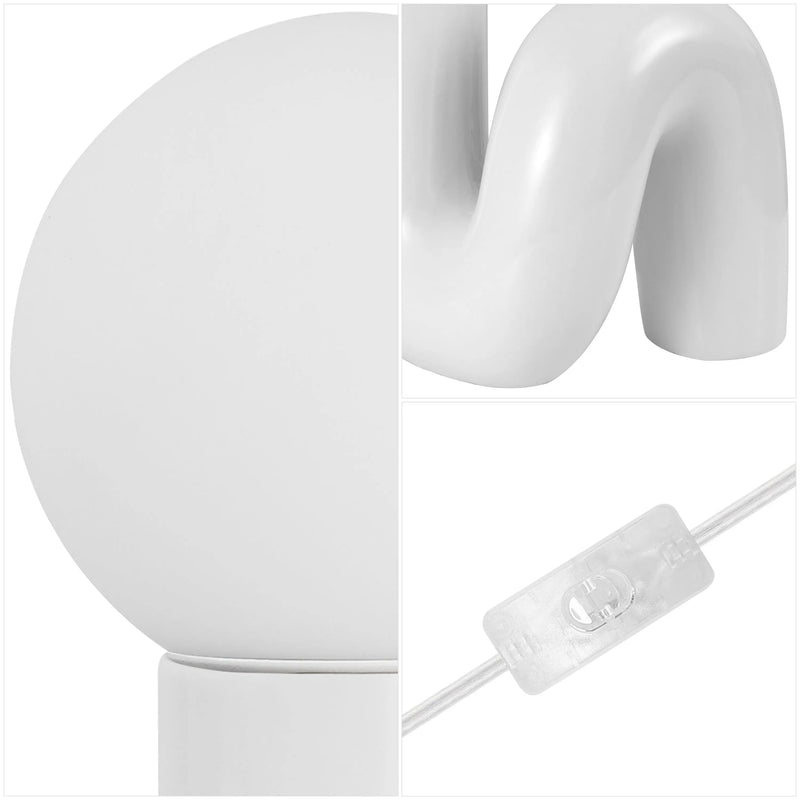 Modern white ceramic table lamp with a rounded base, wavy body, and clear cord switch for stylish decor.