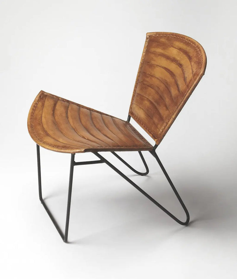 Mid-century modern chair with curved brown leather seat and black metal frame, perfect for stylish interiors.
