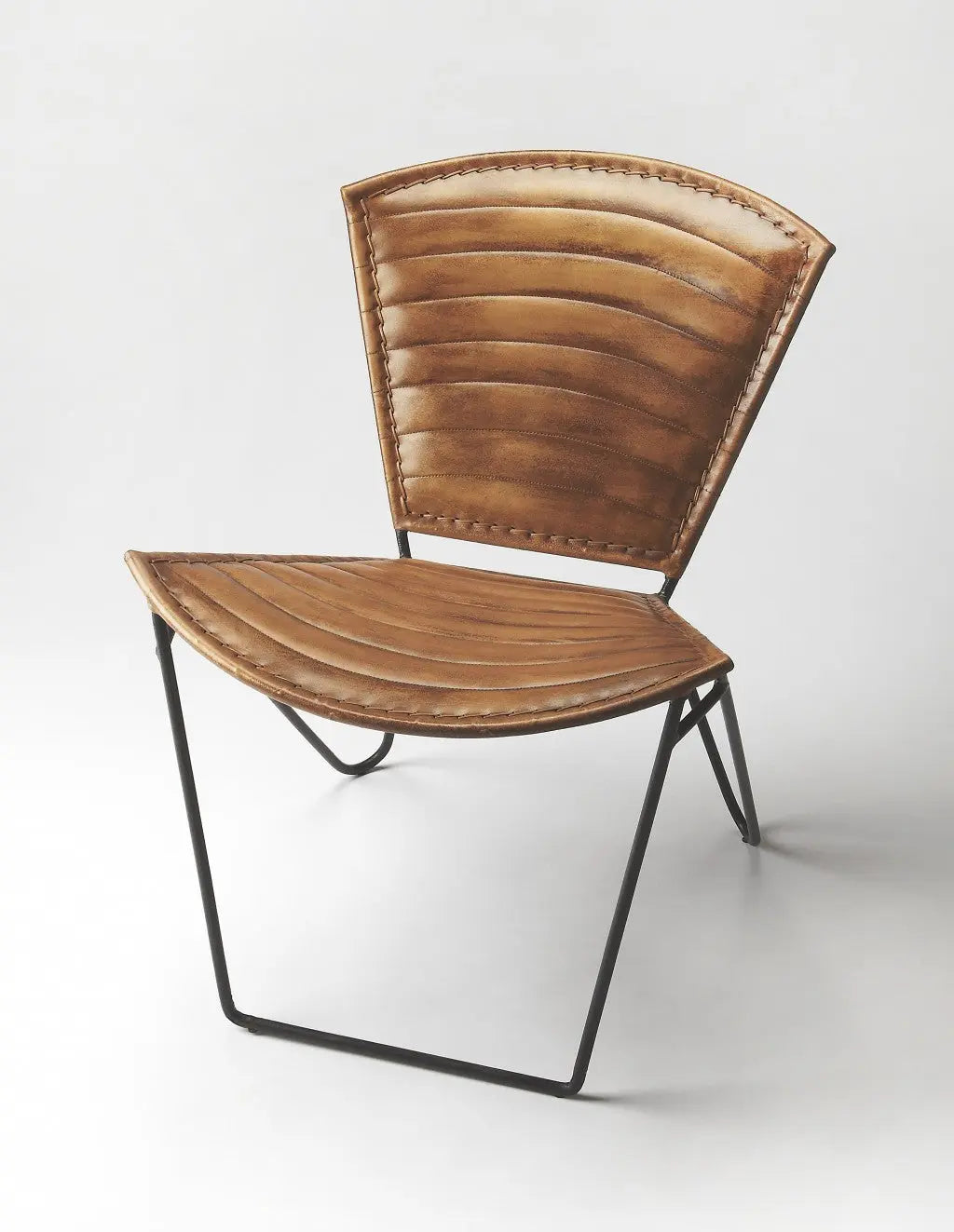 Rustic brown leather accent chair with ribbed design and sleek black metal frame, ideal for modern home decor.