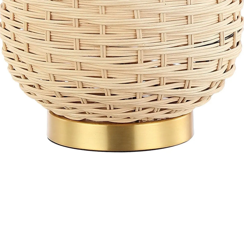 Natural woven rattan basket with a sleek gold metal base, perfect for stylish home decor.