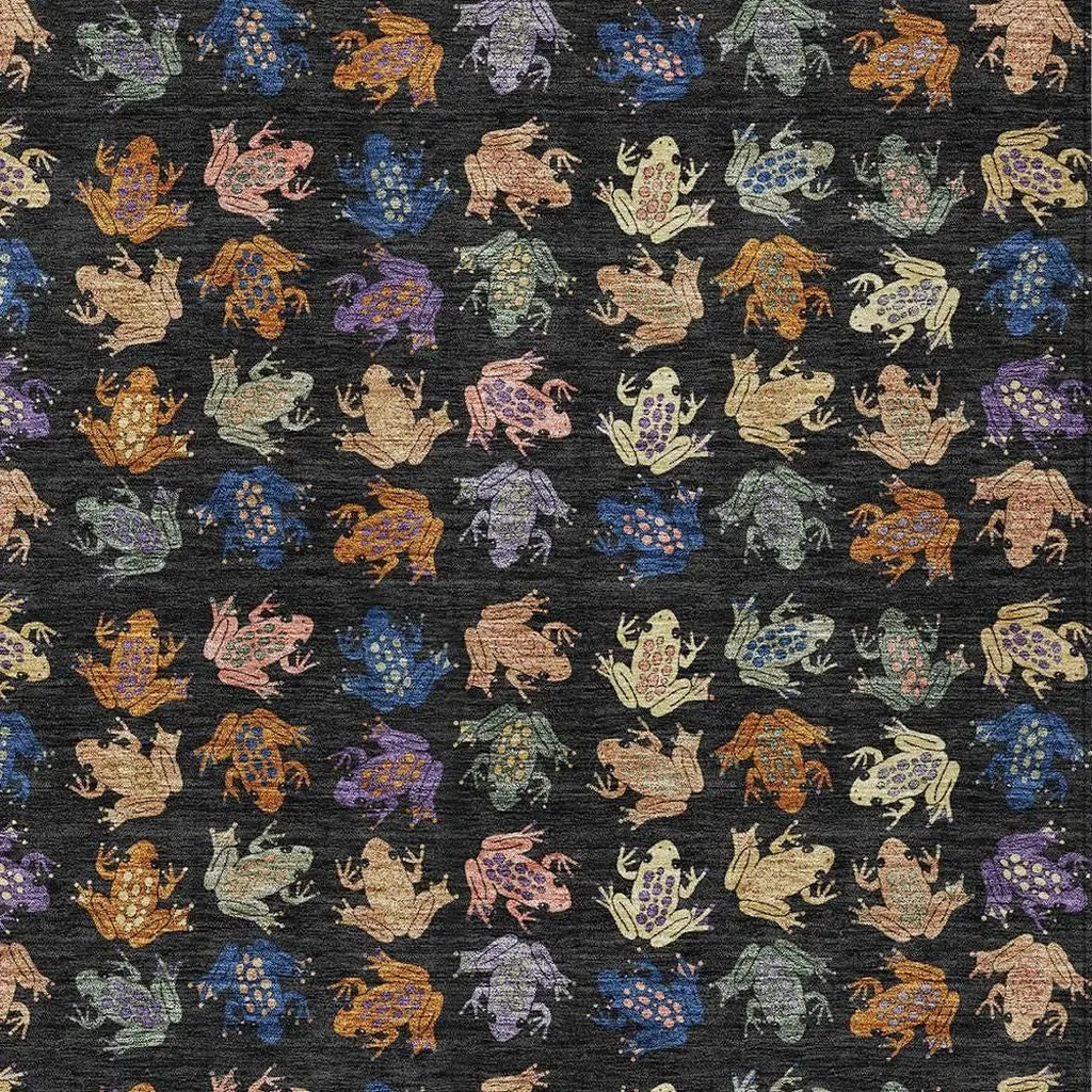 Multicolored frog pattern on black fabric, featuring intricate details and a whimsical, playful style. Perfect for apparel or crafts.