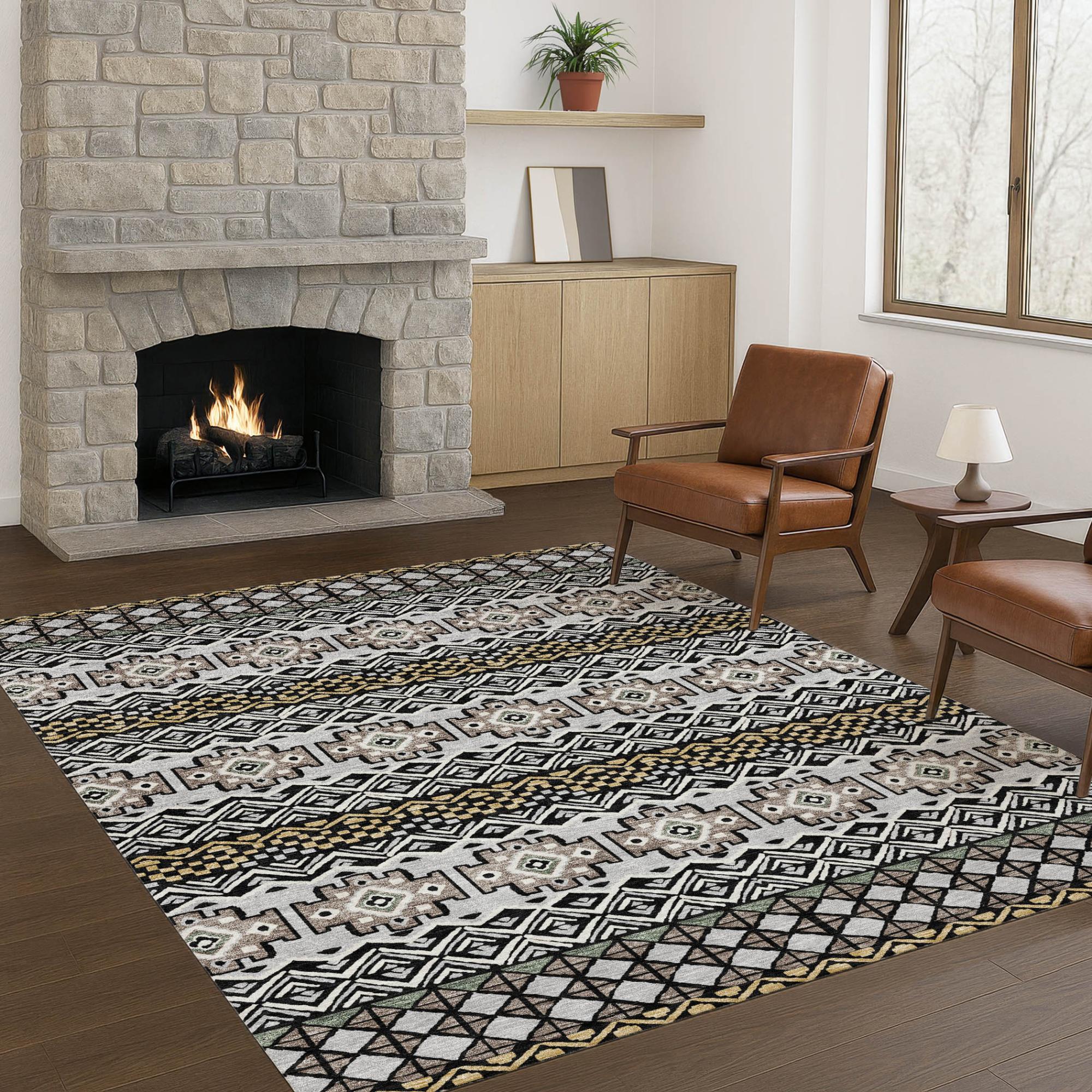 Grey and beige geometric patterned area rug in a modern living room with a stone fireplace and brown leather chairs.