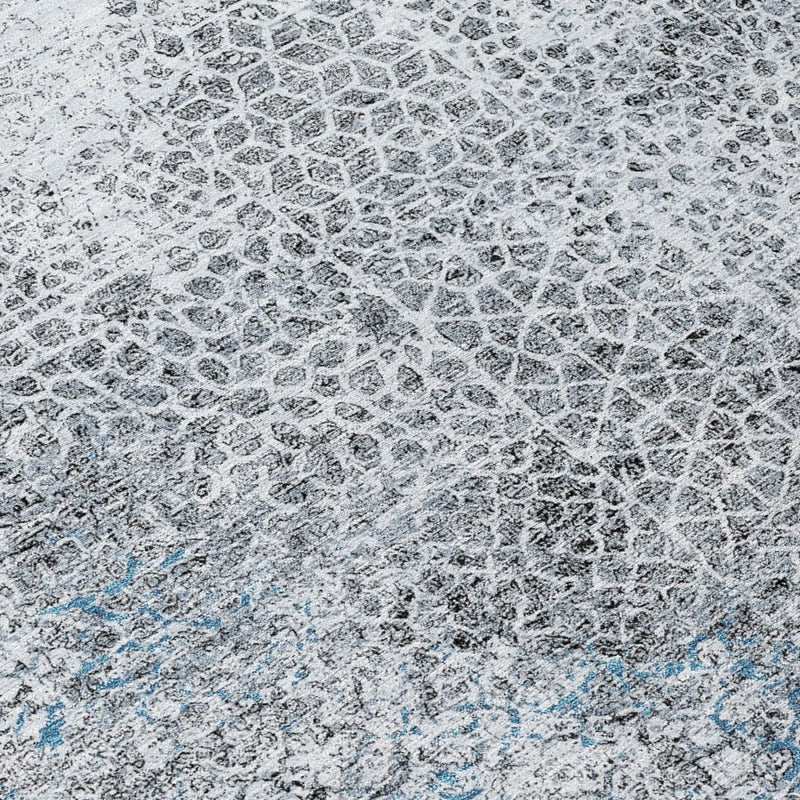 Abstract gray and blue textured area rug in modern style, featuring a contemporary honeycomb pattern.