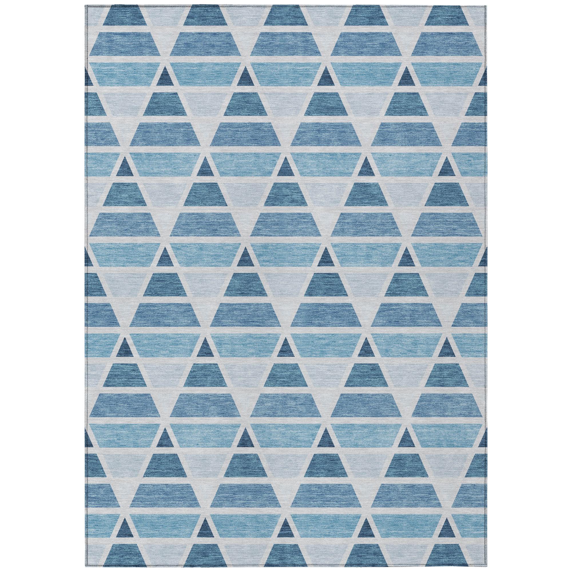 Blue and white geometric triangle area rug, soft synthetic fibers, modern style, perfect for contemporary decor.