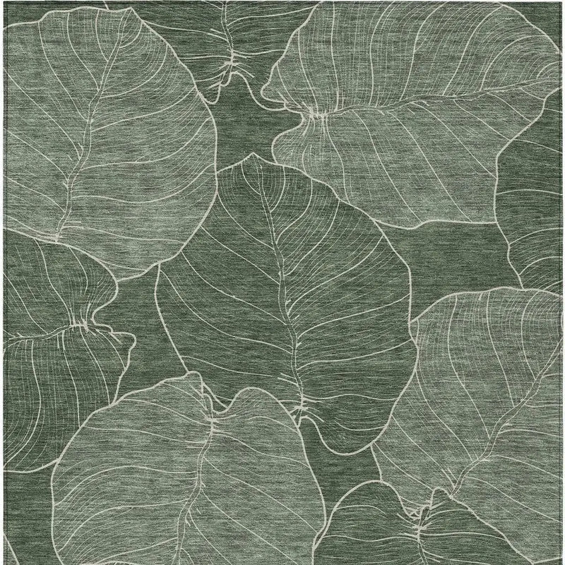 Green leaf patterned area rug with white outlines, made of soft synthetic material, perfect for modern decor.