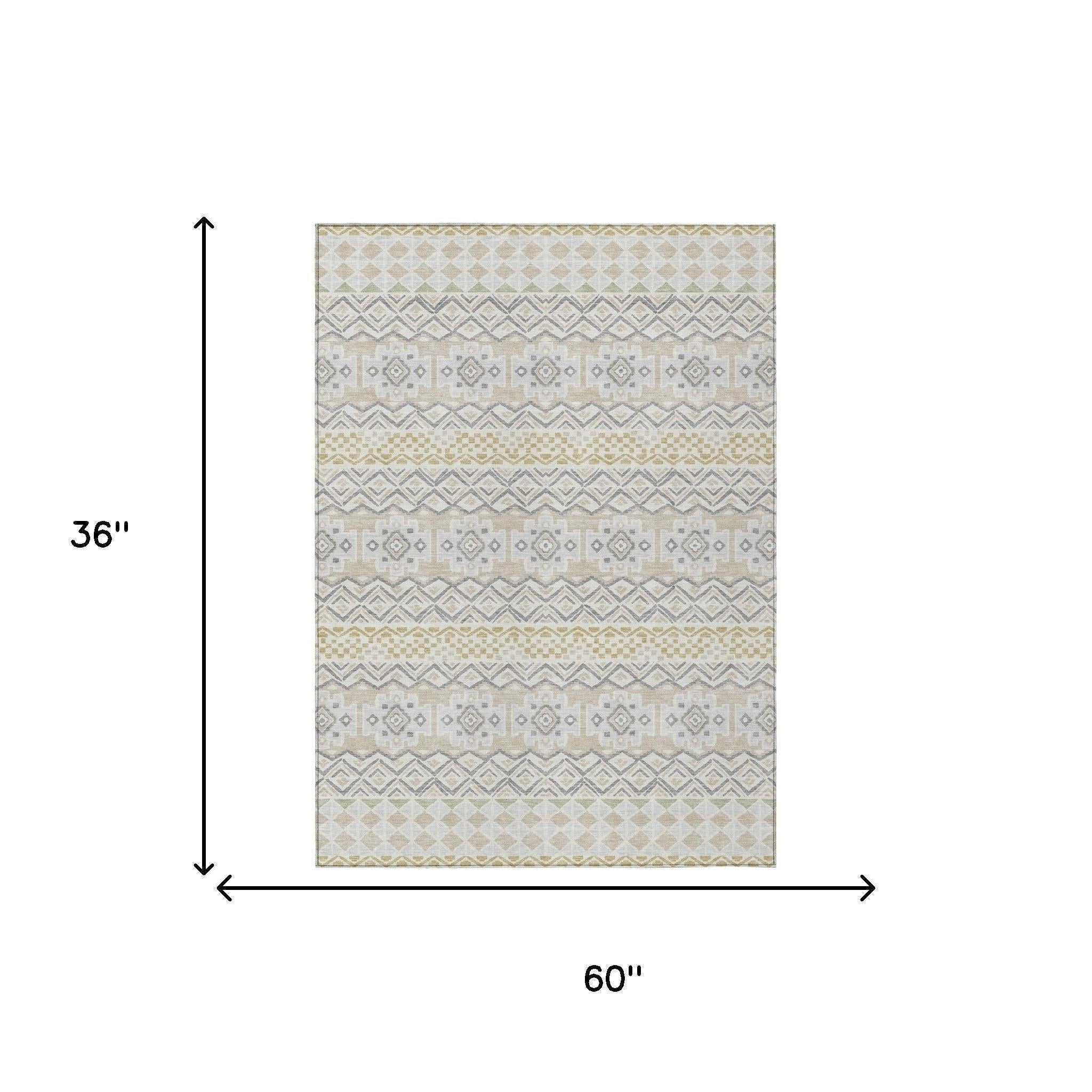 Beige and gray patterned area rug, 36" x 60", featuring tribal geometric designs, woven fabric ideal for modern decor.