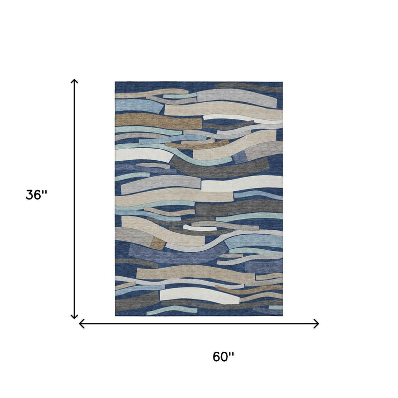 Abstract blue and beige area rug, 60" x 36", crafted from soft, durable materials, perfect for modern decor.