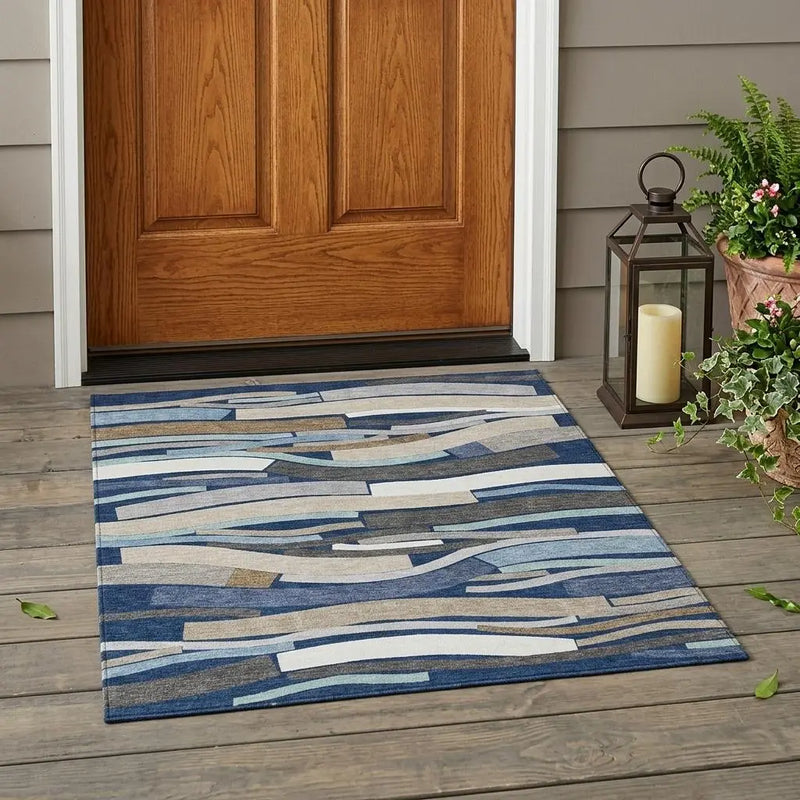 Blue and beige abstract patterned outdoor rug, durable fibers, perfect for entryways and porch decor.