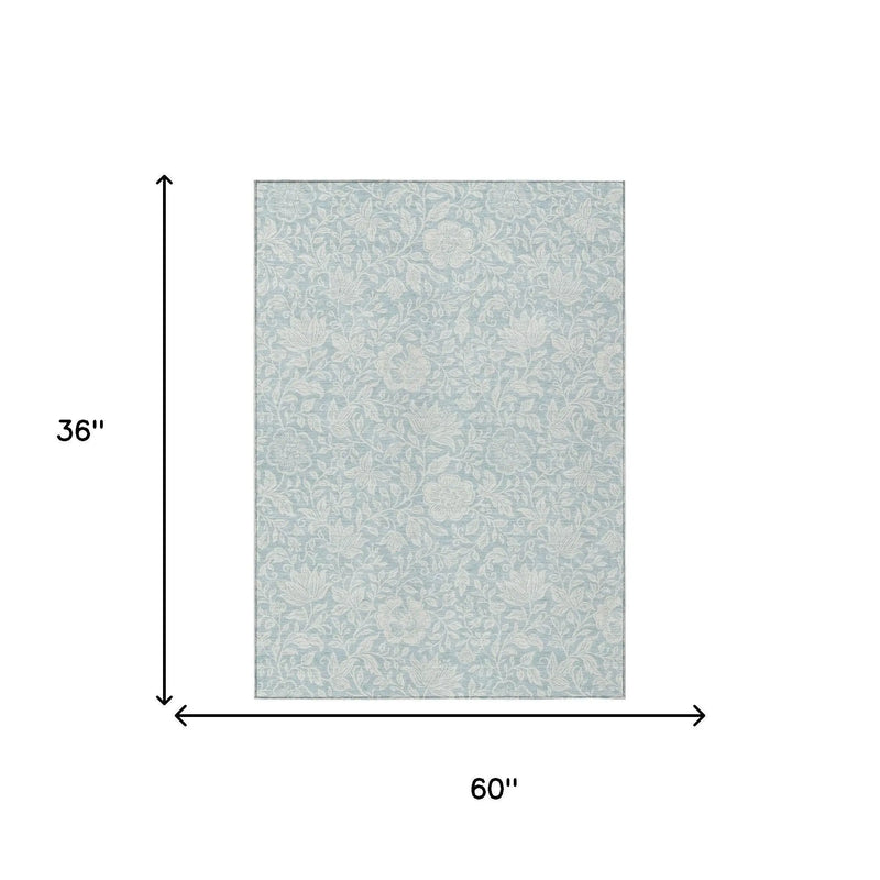 Light blue floral area rug, 60"x36", soft polyester material, stylish for modern or vintage decor.
