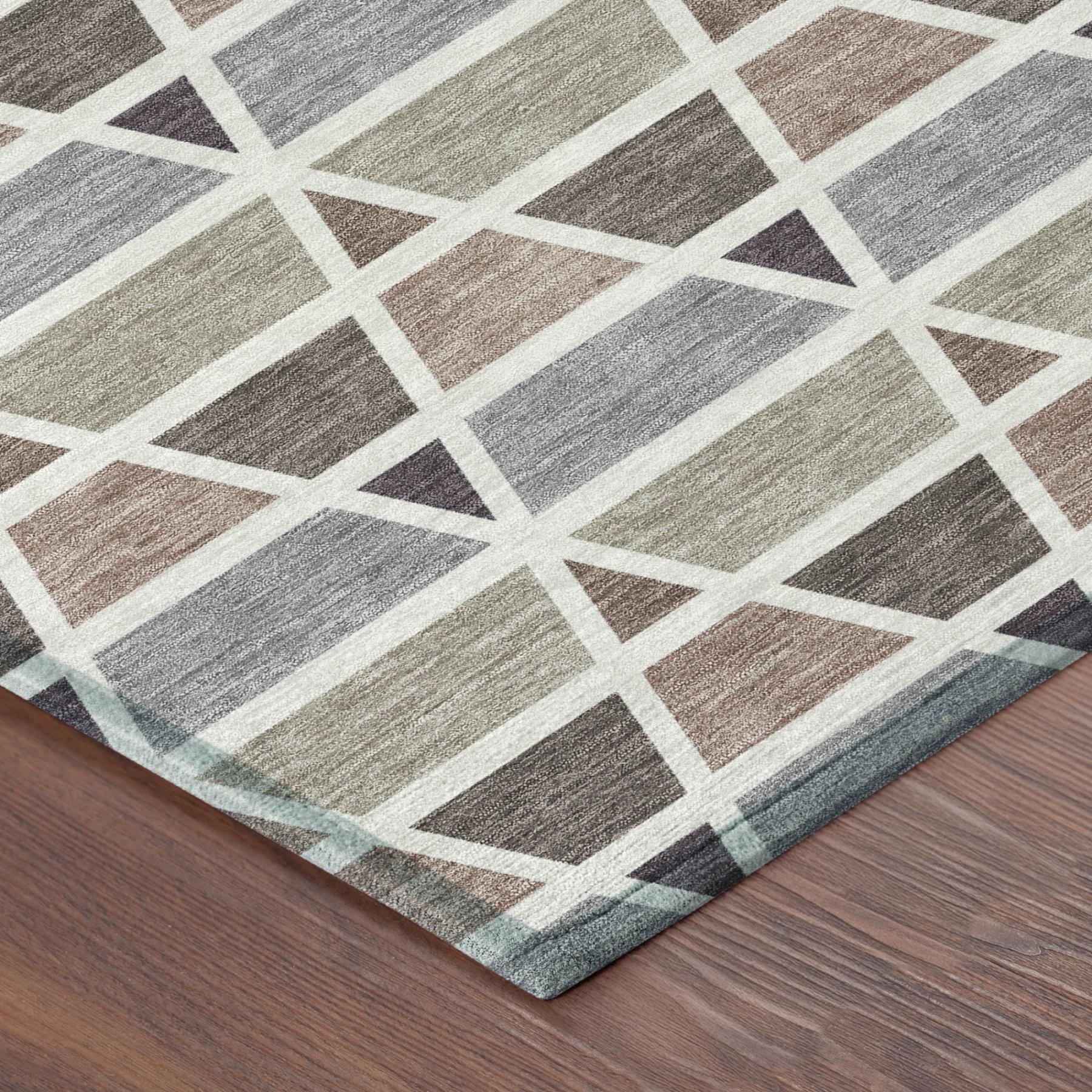 Geometric area rug in earthy tones of gray, brown, and cream, woven with a soft texture for modern decor.