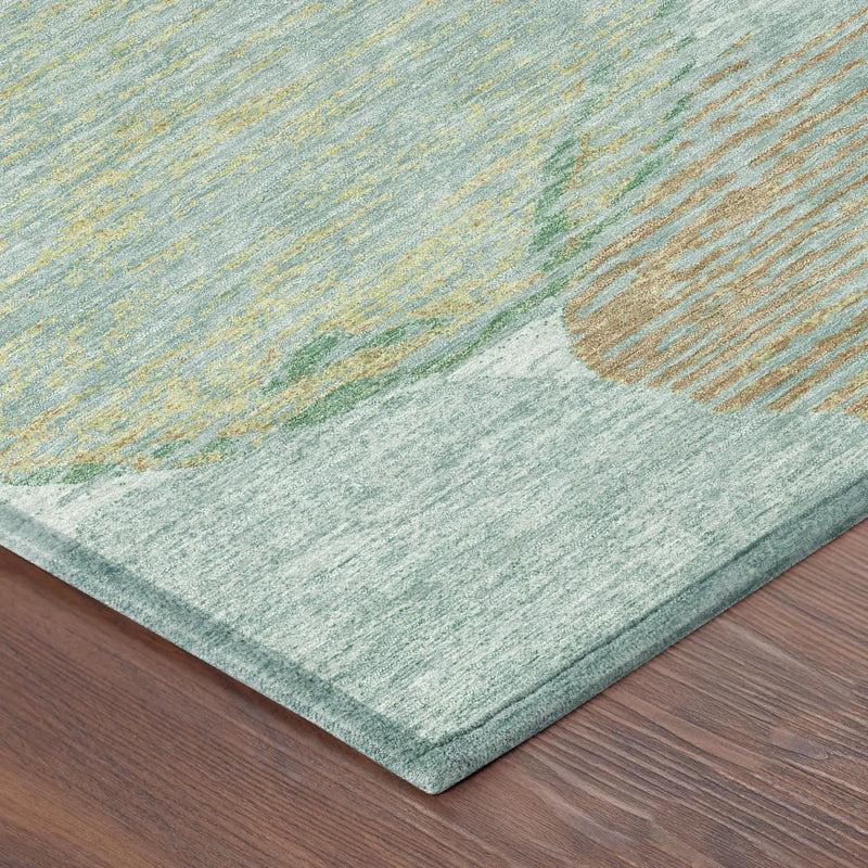 Light green abstract area rug with gold accents, made of soft, durable fibers, perfect for modern home decor.