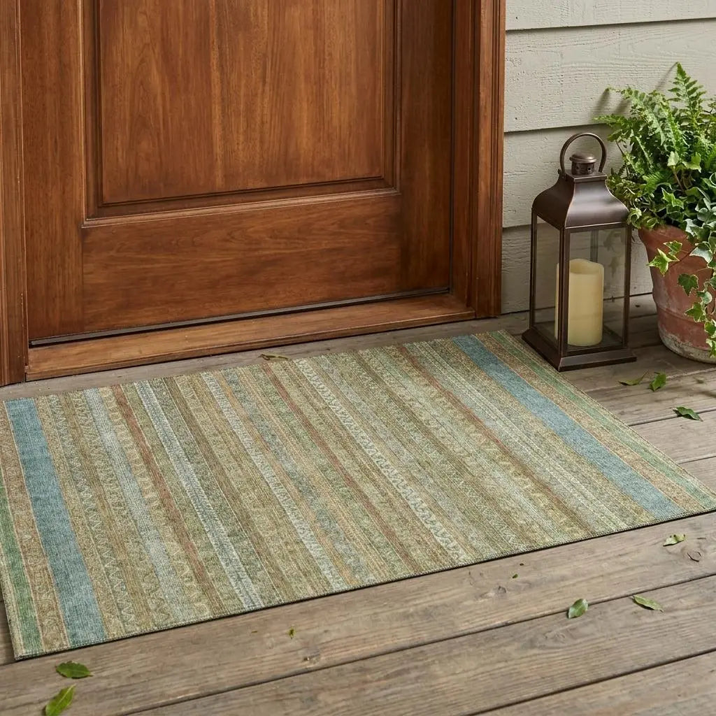 Striped indoor/outdoor rug in green, brown, and blue, made of durable fibers, perfect for entryways and porches.
