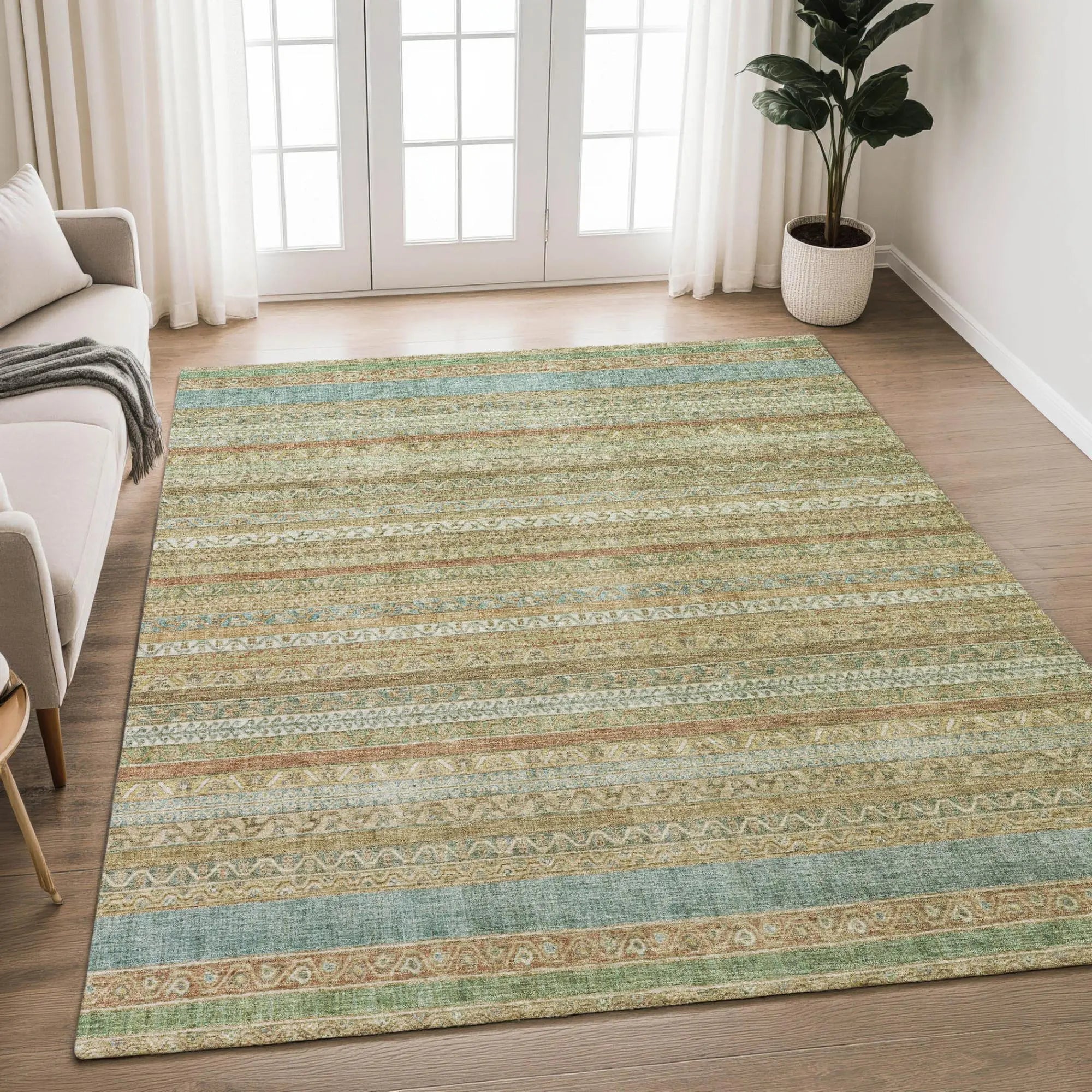 Boho-style area rug in beige, teal, and terracotta with intricate patterns; perfect for living room or bedroom décor.