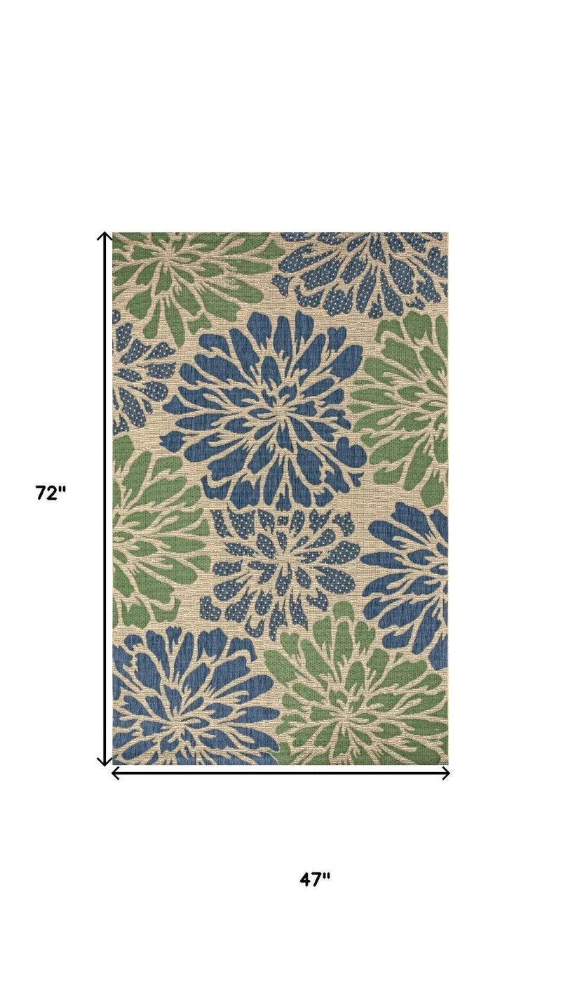 Floral area rug, 72"x47", featuring blue, green, and beige blooms on a natural fiber background. Perfect for indoor/outdoor use.