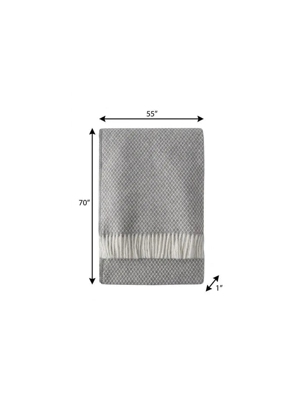 Gray textured woven throw blanket with fringed edges, measuring 55"x70", ideal for cozy living spaces.
