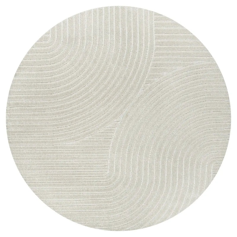 Round beige area rug with textured wavy pattern, soft material, ideal for modern or minimalist decor.
