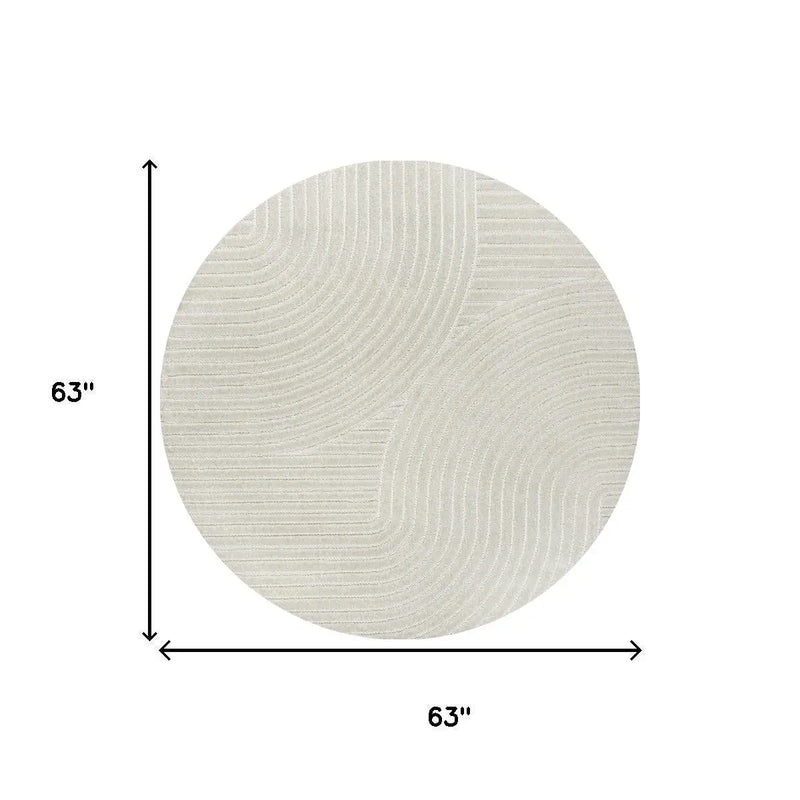 Round 63" beige area rug with textured wave pattern, perfect for modern home decor.