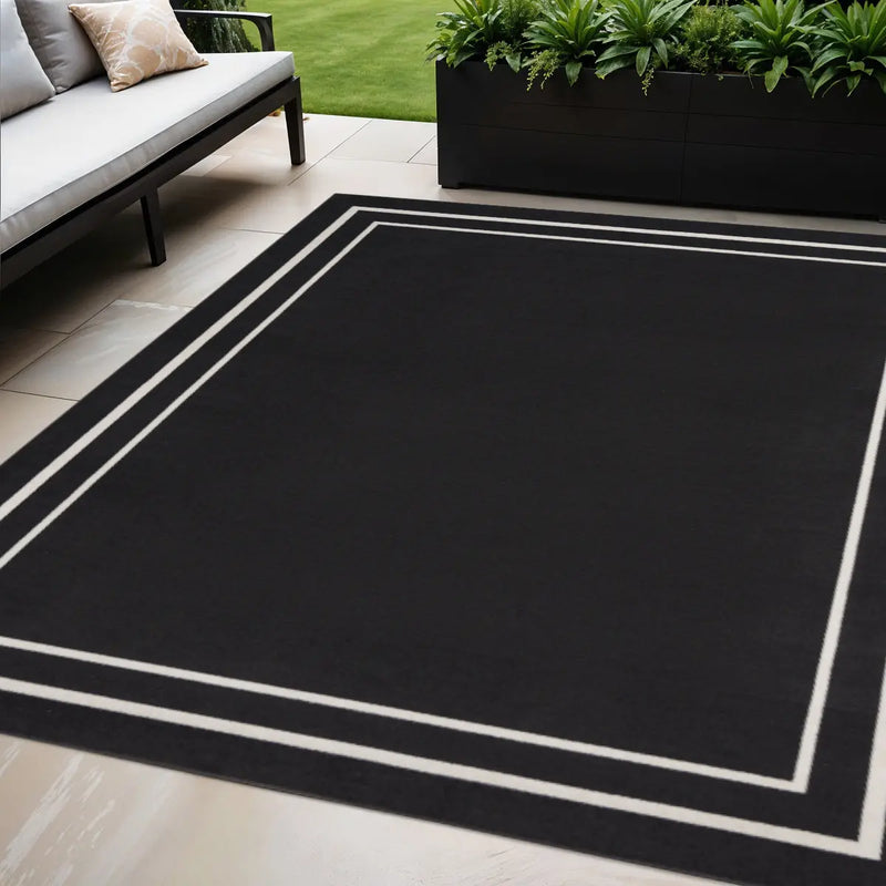 5' X 7' Black And Ivory Indoor Outdoor Area Rug Homeroots Outdoor