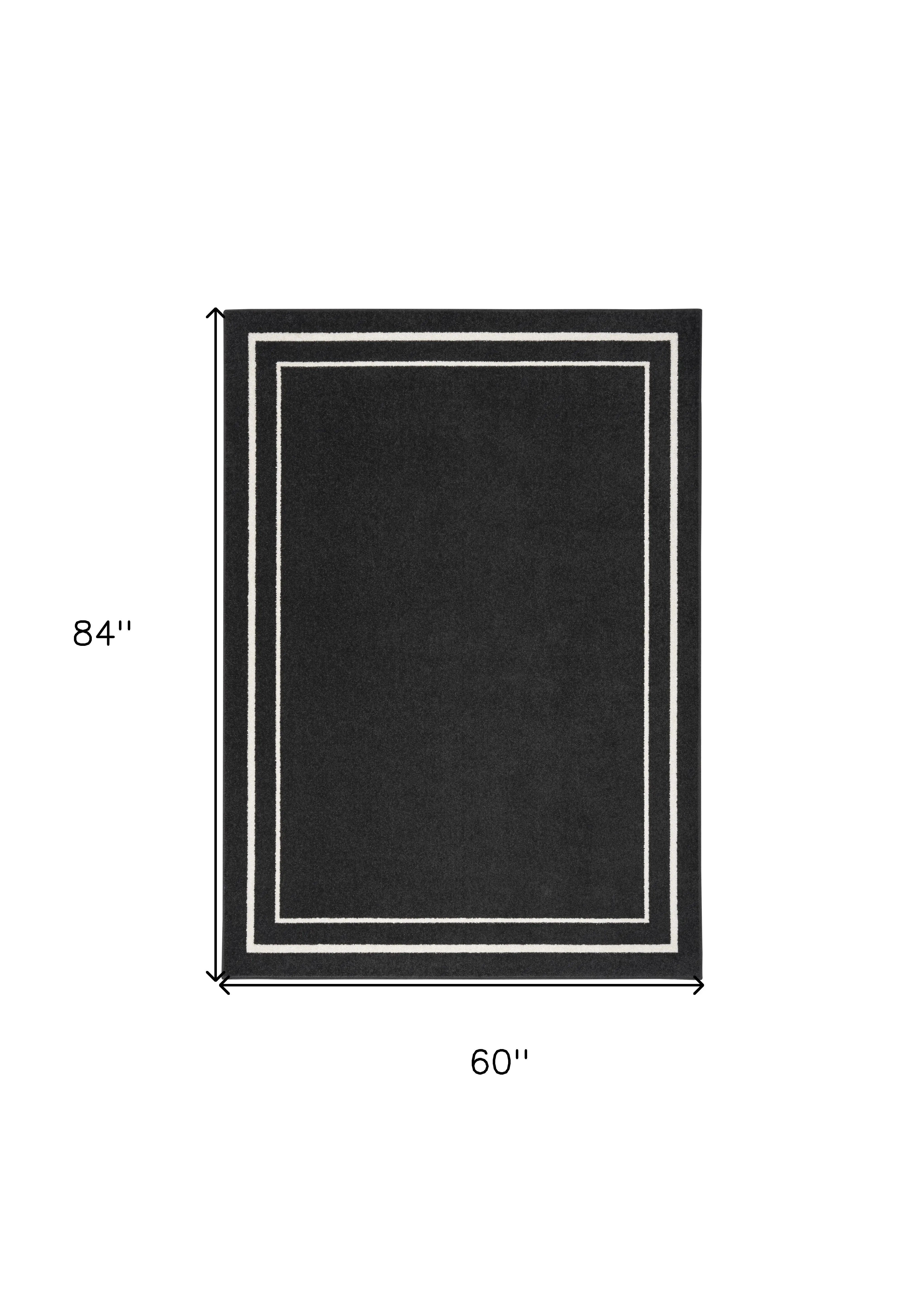5' X 7' Black And Ivory Indoor Outdoor Area Rug Homeroots Outdoor