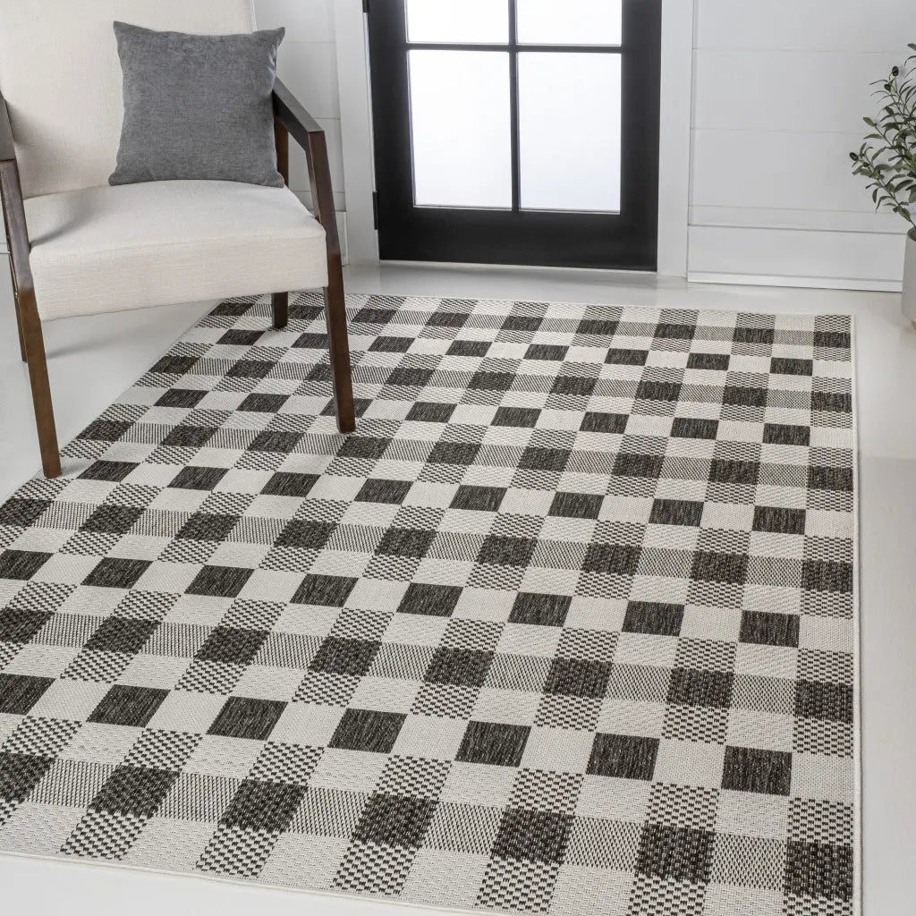 5' X 8' Black And Cream Geometric Indoor Outdoor Area Rug - GreatEagleInc
