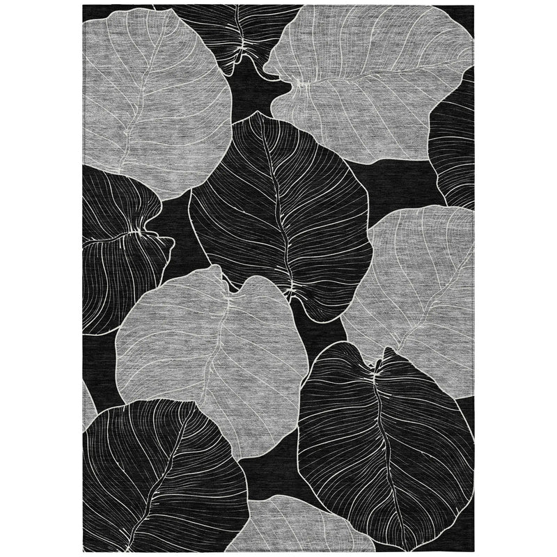 Black and gray leaf-patterned area rug, featuring intricate line art on soft, textured fabric. Ideal for modern decor.