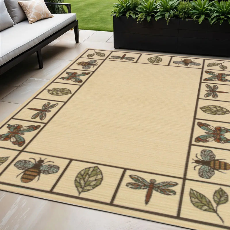 Beige outdoor rug featuring colorful bees and dragonflies with a leaf border, perfect for patios and gardens.