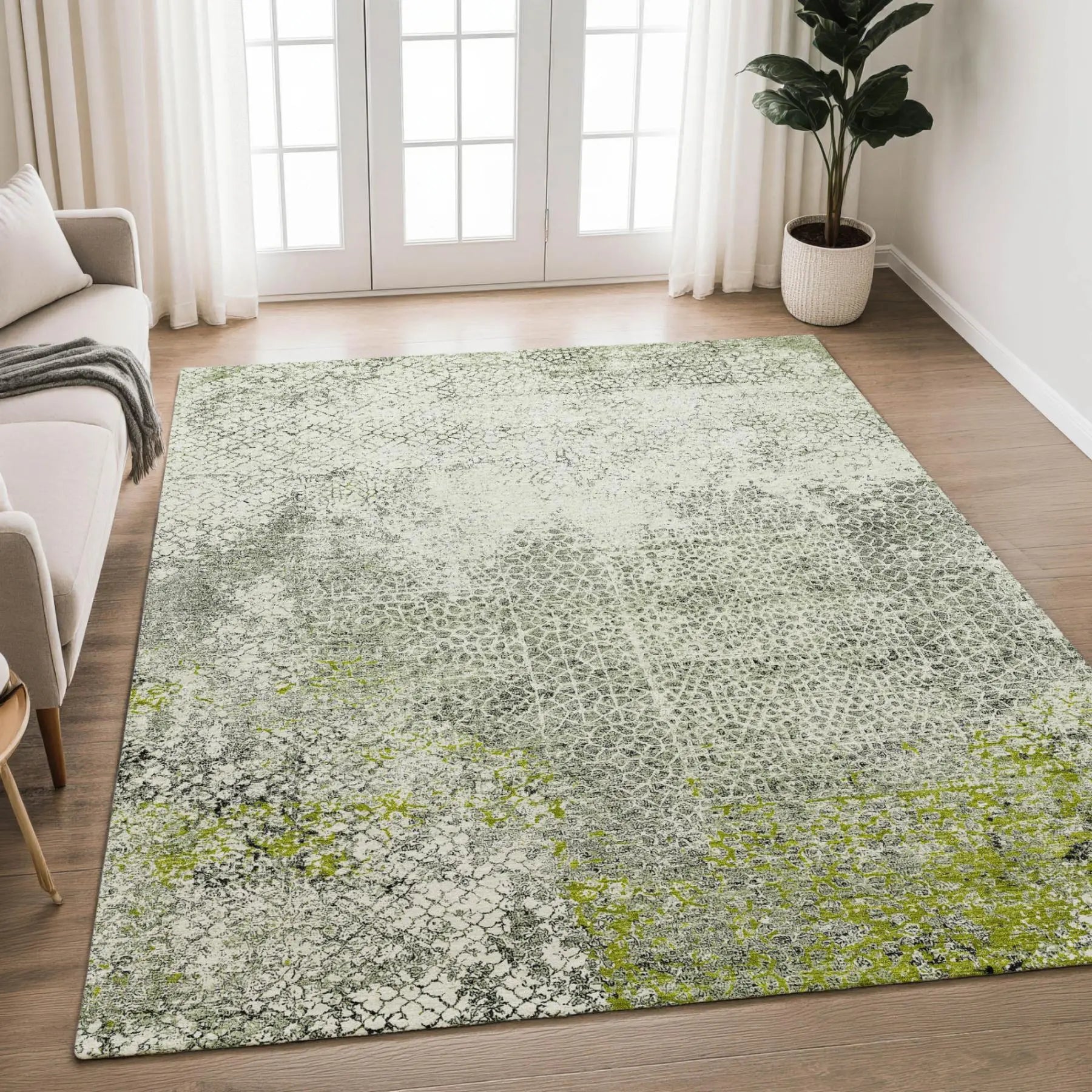 Green and gray abstract area rug, textured polyester blend, modern style, perfect for living or dining spaces.