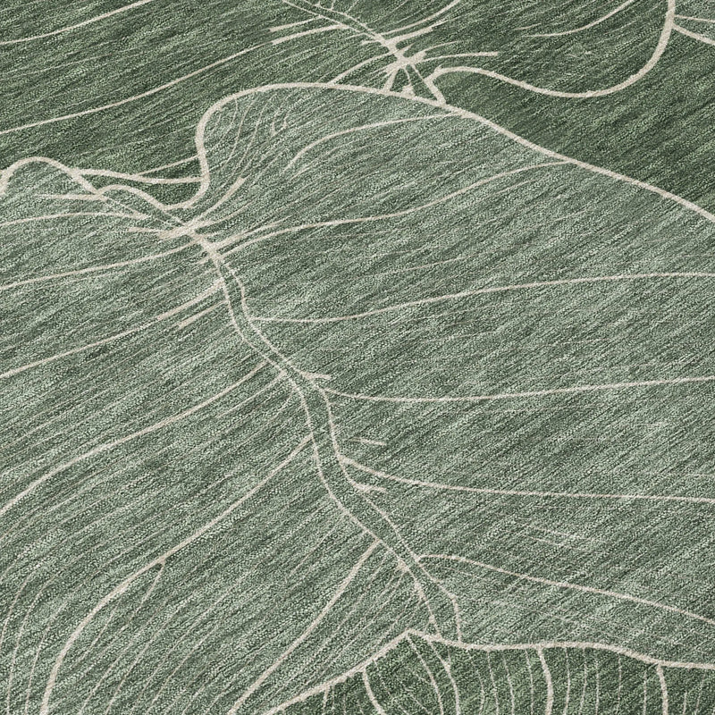 Green and white abstract leaf design area rug, soft textile, modern style, perfect for contemporary decor.
