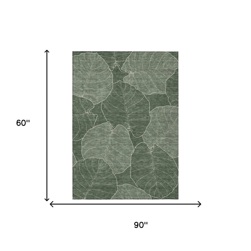Green leaf-printed area rug, 90"x60", woven fabric, modern botanical design for stylish home decor.