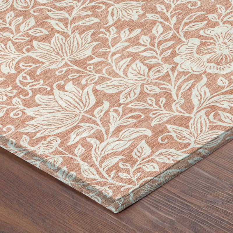 Blush floral pattern area rug with cream accents, made of durable synthetic fibers for stylish home decor.