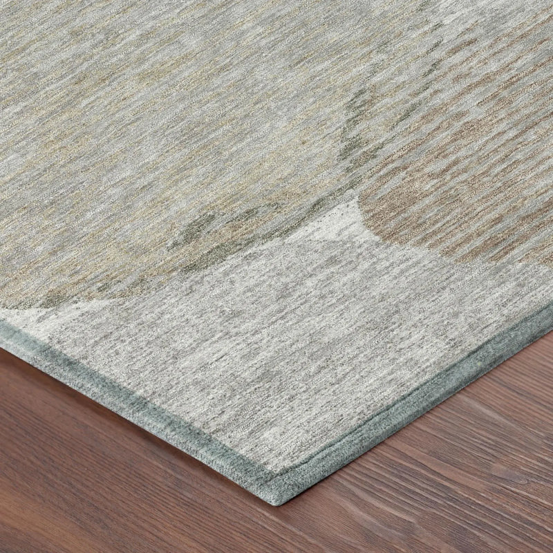 Light gray area rug with abstract design, soft synthetic material, and a subtle green border, perfect for modern decor.