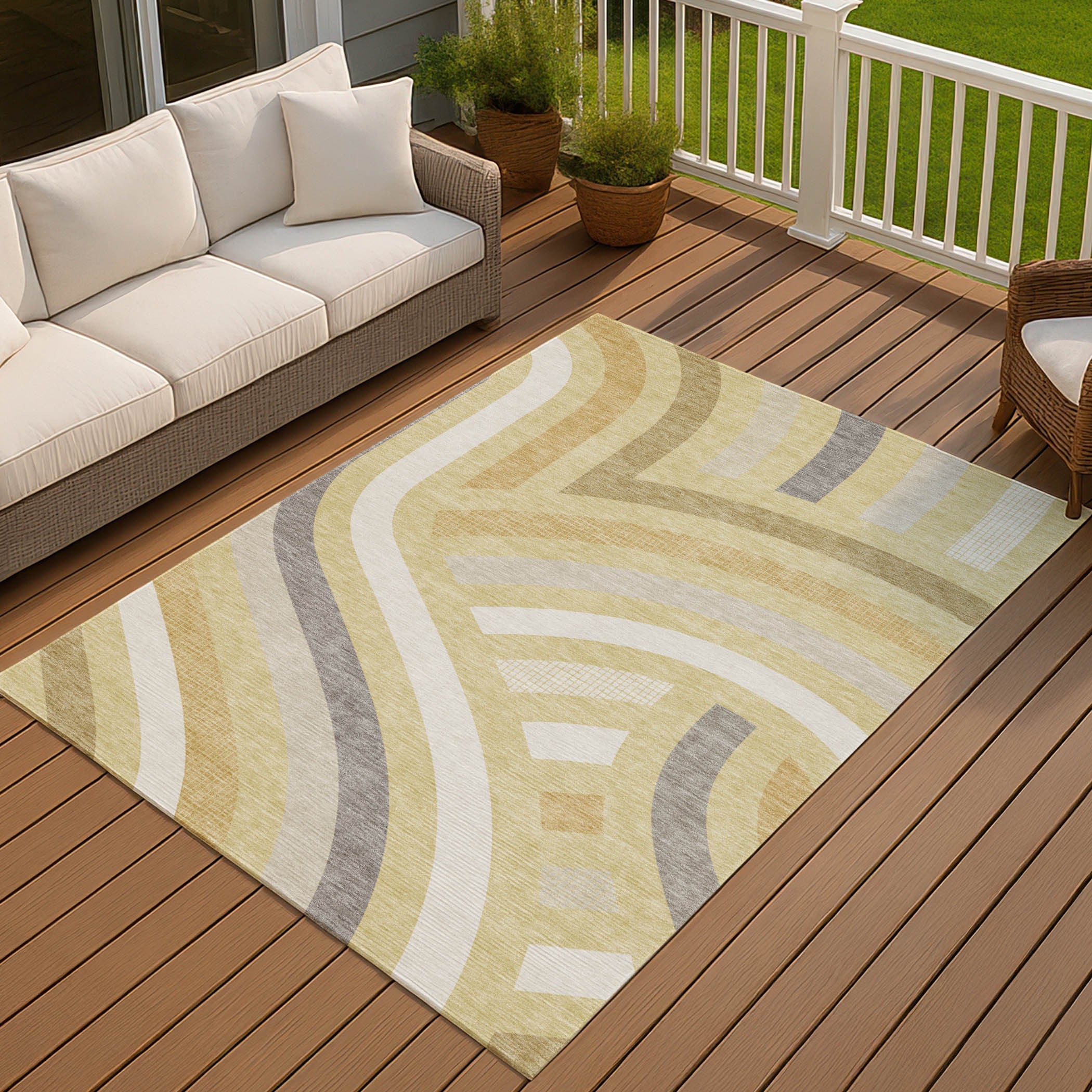 Cream and beige abstract area rug with gray accents, perfect for outdoor or indoor use, adds warmth to any space.
