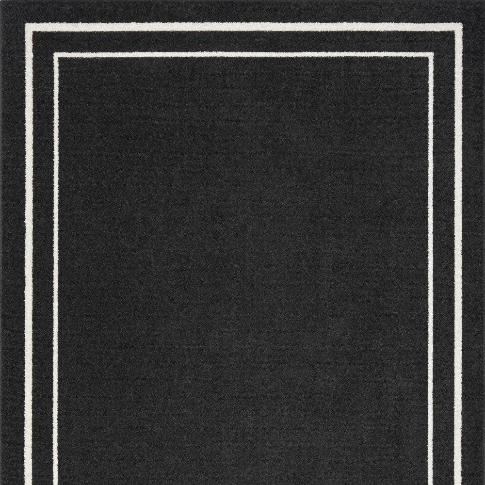 6' X 9' Black And Ivory Indoor Outdoor Area Rug Homeroots Outdoor