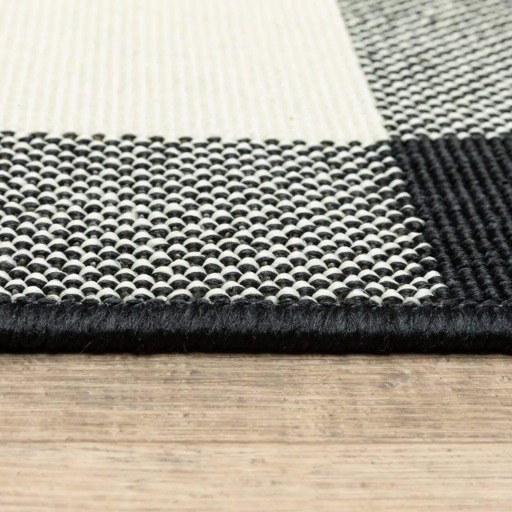 7' X 10' Black And Ivory Indoor Outdoor Area Rug Homeroots Outdoor