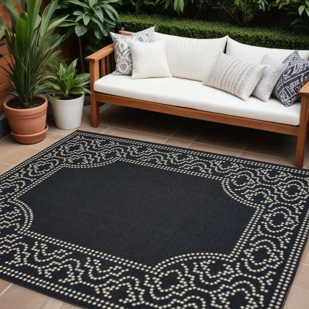 7' X 10' Black and Ivory Stain Resistant Indoor Outdoor Area Rug Homeroots Outdoor