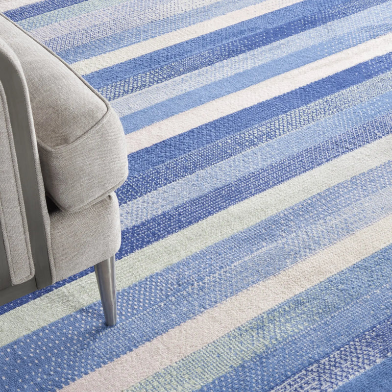 7' X 10' Ivory Tan and Blue Abstract Distressed Non Skid Area Rug Homeroots Home Decor