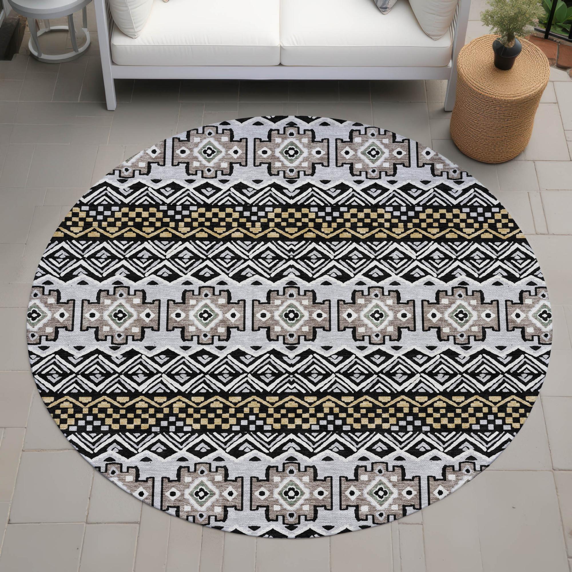 Round area rug featuring tribal pattern in black, white, and gold hues, crafted from durable, soft materials.
