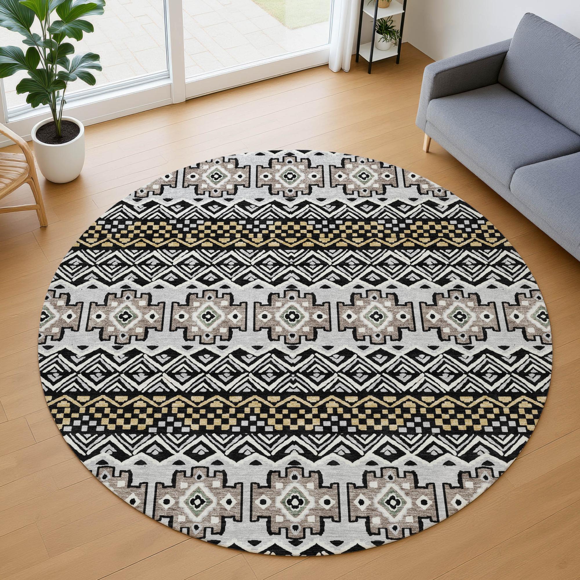 Round geometric area rug in black, beige, and gold, featuring tribal patterns, ideal for modern home decor.