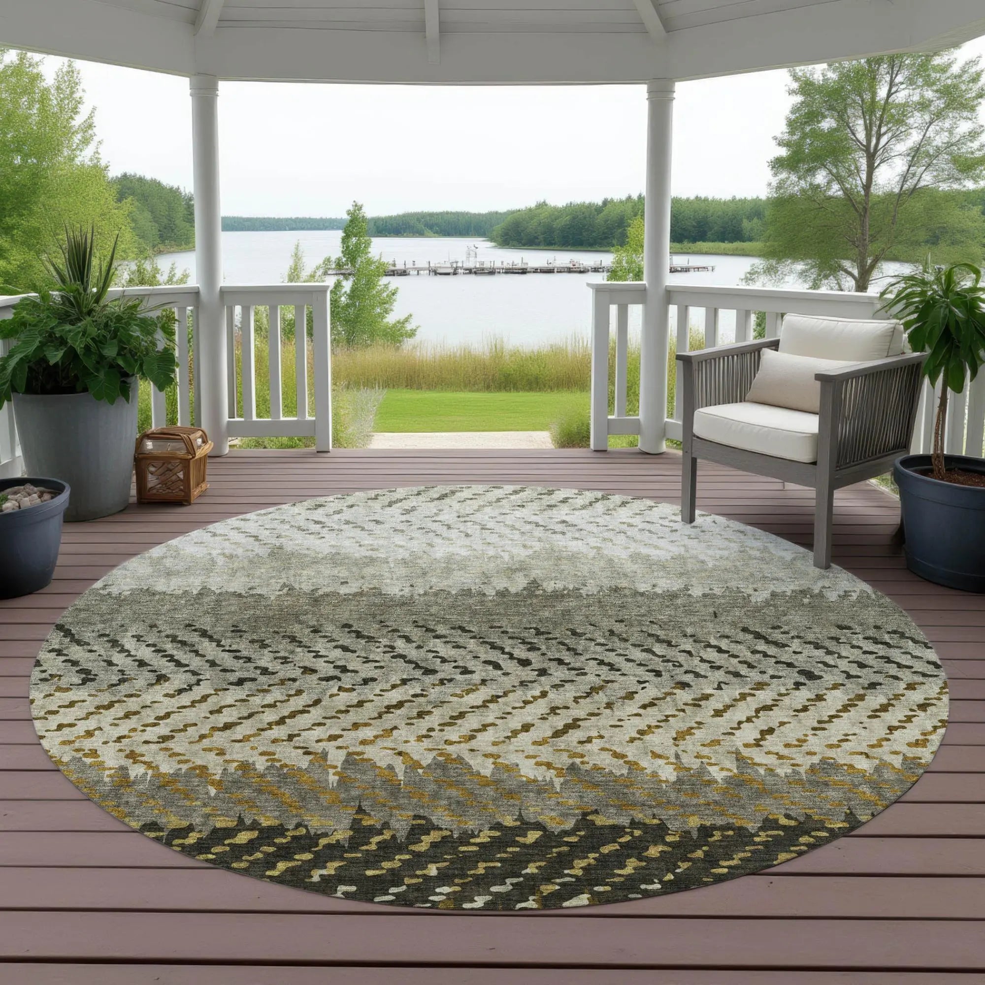 Cream and gray round braided outdoor rug, perfect for patios, featuring a modern geometric pattern and durable materials.