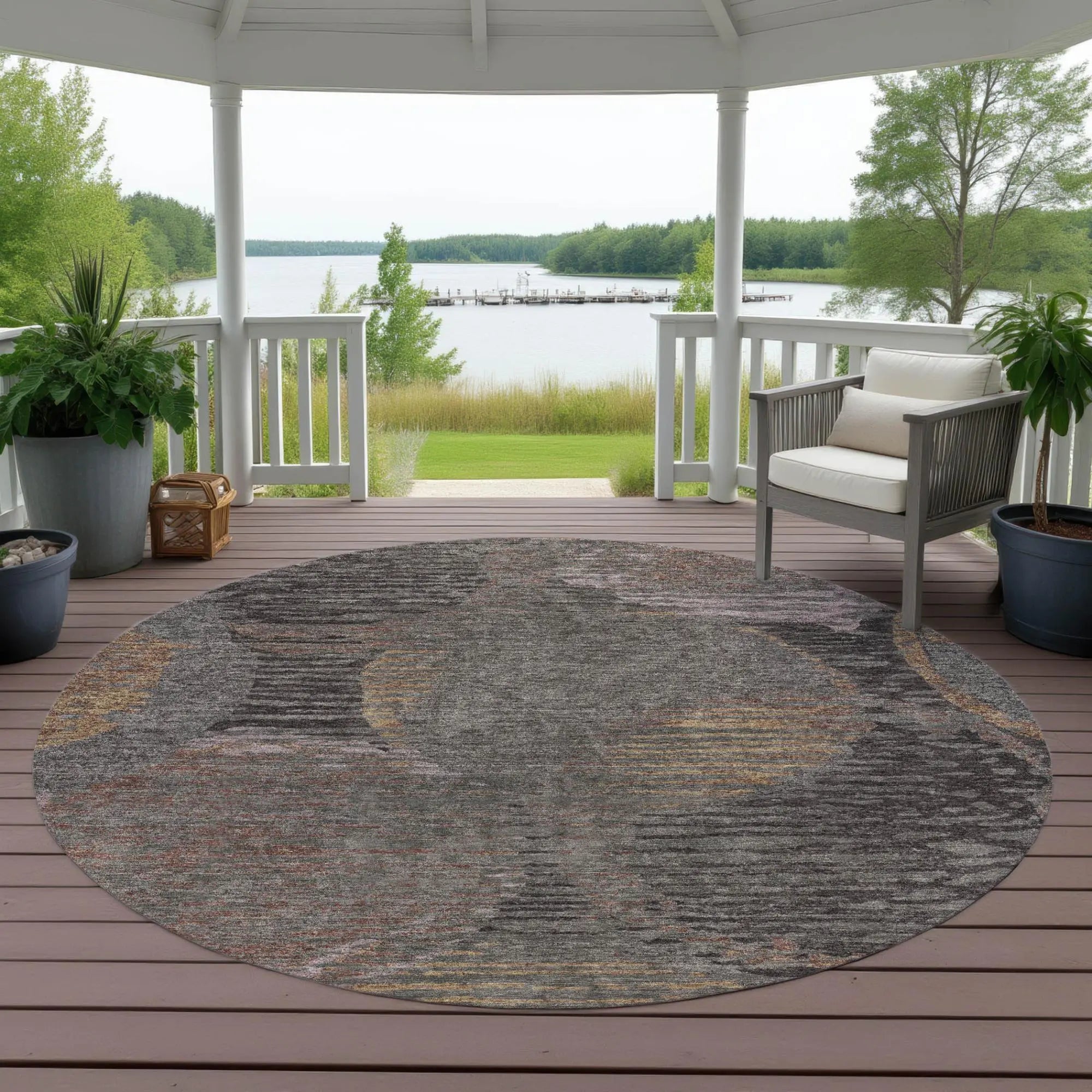 Round grey and multicolor area rug, soft texture, ideal for outdoor patios or living spaces, enhancing natural aesthetics.